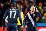 JOHANNESBURG, SOUTH AFRICA - JUNE 18:  Michael Bradley and Jozy Altidore of the United States dispute a decision with Referee Koman Coulibaly during the 2010 FIFA World Cup South Africa Group C match between Slovenia and USA at Ellis Park Stadium on June 18, 2010 in Johannesburg, South Africa.  (Photo by Kevork Djansezian/Getty Images)