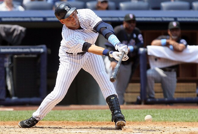 NEW YORK - JUNE 20:  Derek Jeter #2 of the New York Yankees connects for a third inning infield base hit against the New York Mets on June 20, 2010 at Yankee Stadium in the Bronx borough of New York City.  (Photo by Jim McIsaac/Getty Images)