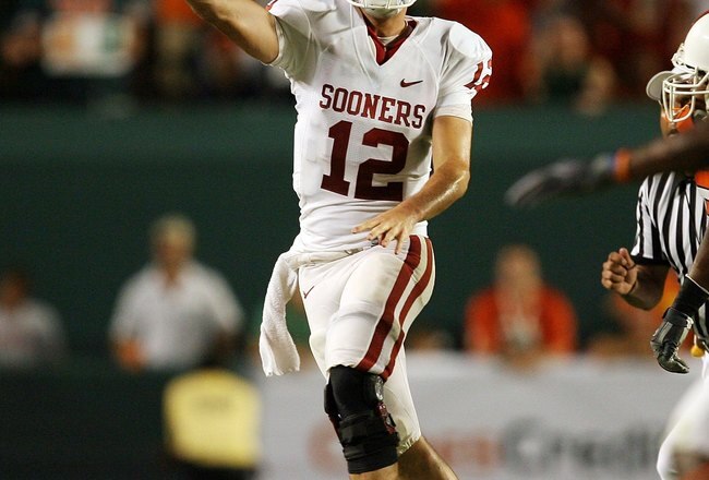 MIAMI GARDENS, FL - OCTOBER 03:  Quarterback Landry Jones #12 of the Oklahoma Sooners throws a pass against the Miami Hurricanes at Land Shark Stadium on October 3, 2009 in Miami Gardens, Florida. Miami defeated Oklahoma 21-20.  (Photo by Doug Benc/Getty Images)