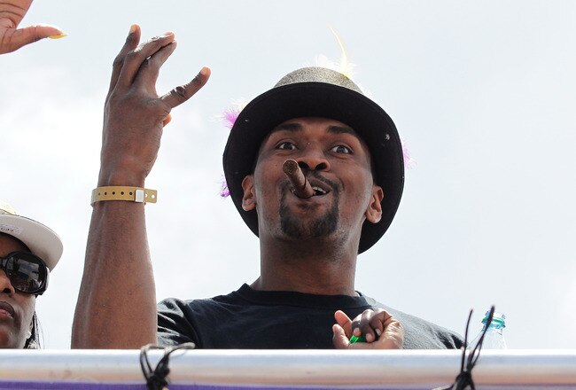 LOS ANGELES, CA - JUNE 21:  Los Angeles Lakers small forward Ron Artest waves to the fans while riding in the victory parade for the the NBA basketball champion team on June 21, 2010 in Los Angeles, California. The Lakers beat the Boston Celtics 87-79 in 7 games for the franchise's 16 NBA title.  (Photo by Noel Vasquez/Getty Images)