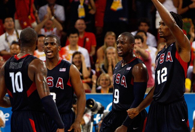 BEIJING - AUGUST 24: Kobe Bryant #10 of the United States celebrate a play with teammates Chris Paul #13, Dwyane Wade #9 and Chris Bosh #12 in the gold medal game against Spain during Day 16 of the Beijing 2008 Olympic Games at the Beijing Olympic Basketball Gymnasium on August 24, 2008 in Beijing, China.  (Photo by Streeter Lecka/Getty Images)