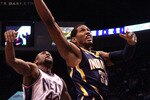 EAST RUTHERFORD, NJ - JANUARY 15:  Danny Granger #33 of the Indiana Pacers drives to the hoop for a basket against Trenton Hassell #44 of the New Jersey Nets at the Izod Center on January 15, 2010 in East Rutherford, New Jersey. NOTE TO USER: User expressly acknowledges and agrees that, by downloading and or using this photograph, User is consenting to the terms and conditions of the Getty Images License Agreement.  (Photo by Jim McIsaac/Getty Images)