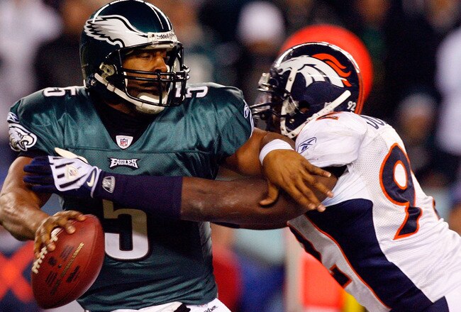 PHILADELPHIA - DECEMBER 27:  Donovan McNabb #5 of the Philadelphia Eagles is pressured by Elvis Dumervil #92 of the Denver Broncos on December 27, 2009 at Lincoln Financial Field in Philadelphia, Pennsylvania. The Eagles defeated the Broncos 30-27.  (Photo by Jim McIsaac/Getty Images)