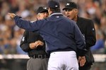 SEATTLE - JUNE 06:  Manager Don Wakamatsu #22 of the Seattle Mariners argues with first base umpire Tim Tschida as home plate umpire Tim Timmons looks on during the game against the Los Angeles Angels of Anaheim at Safeco Field on June 6, 2010 in Seattle, Washington. Wakamatsu was ejected from the game.(Photo by Otto Greule Jr/Getty Images)