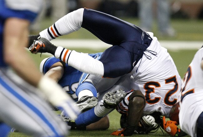 DETROIT - JANUARY 03:  Devin Hester #23 of the Chicago Bears is flipped over during a kick return while playing the Detroit Lions on January 3, 2010 at Ford Field in Detroit, Michigan. Chicago won the game 37-23.  (Photo by Gregory Shamus/Getty Images)