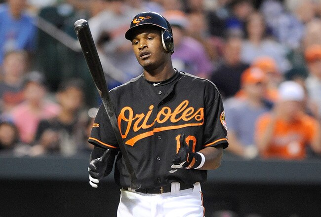 BALTIMORE - JUNE 11:  Adam Jones #10 of the Baltimore Orioles reacts after striking out against the New York Mets at Camden Yards on June 11, 2010 in Baltimore, Maryland.  (Photo by Greg Fiume/Getty Images)