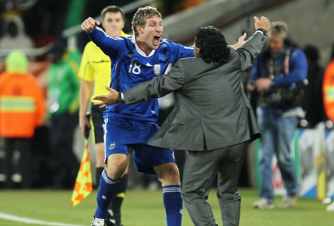 POLOKWANE, SOUTH AFRICA - JUNE 22:  Diego Maradona head coach of Argentina celebrates with goalscorer Martin Palermo after the 2010 FIFA World Cup South Africa Group B match between Greece and Argentina at Peter Mokaba Stadium on June 22, 2010 in Polokwane, South Africa.  (Photo by Chris McGrath/Getty Images)