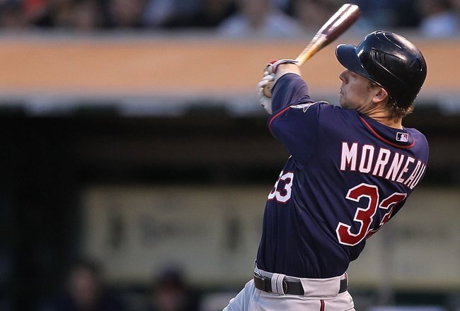 OAKLAND, CA - JUNE 04:  Justin Morneau #33 of the Minnesota Twins bats against the Oakland Athletics during an MLB game at the Oakland-Alameda County Coliseum on June 4, 2010 in Oakland, California.  (Photo by Jed Jacobsohn/Getty Images)