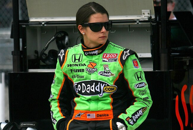 IOWA CITY, IA - JUNE 19:  Danica Patrick, driver of the #7 Team Godaddy.com Andretti Autosport Dallara Honda, sits on the pit wall during qualifying for the IRL Indycar Series Iowa Corn Indy 250 on June 19, 2010 at the Iowa Speedway in Newton, Iowa.  (Photo by Chris Trotman/Getty Images)
