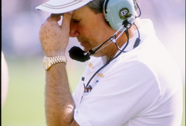 30 Sep 1989: Coach Fred Akers of the Purdue Boilermakers holds his head during a game against the Notre Dame Fighting Irish at Ross Ade Stadium in West Lafayette, Indiana . Notre Dame won the game 40-7.