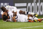 PRETORIA, SOUTH AFRICA - JUNE 23:  Landon Donovan of the United States celebrates scoring the winning goal that sends the USA through to the second round with team mates Clint Dempsey and Jozy Altidore during the 2010 FIFA World Cup South Africa Group C match between USA and Algeria at the Loftus Versfeld Stadium on June 23, 2010 in Tshwane/Pretoria, South Africa.  (Photo by Martin Rose/Getty Images)