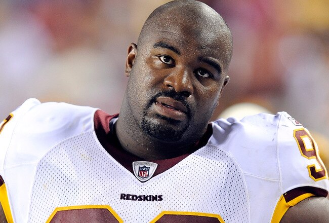 LANDOVER, MD - AUGUST 22:  Albert Haynesworth #92 of the Washington Redskins watches the game against the Pittsburgh Steelers at Fed Ex Field on August 22, 2009 in Landover, Maryland.  (Photo by Greg Fiume/Getty Images)
