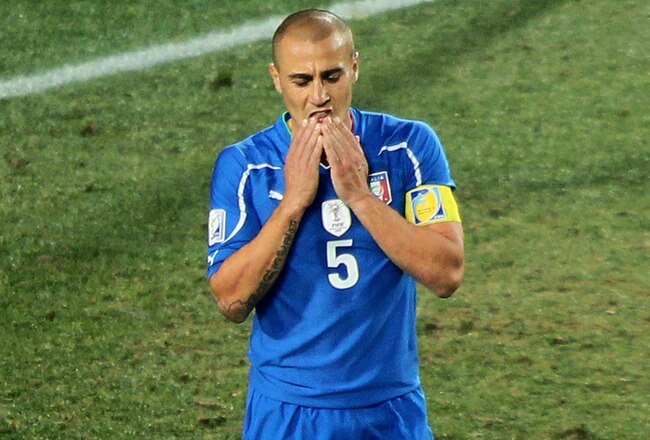JOHANNESBURG, SOUTH AFRICA - JUNE 24:  Fabio Cannavaro, captain of Italy, leaves the field dejected after being knocked out of the competition by Slovakia during the 2010 FIFA World Cup South Africa Group F match between Slovakia and Italy at Ellis Park Stadium on June 24, 2010 in Johannesburg, South Africa.  (Photo by Christof Koepsel/Getty Images)