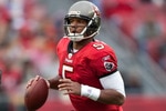 TAMPA, FL - JANUARY 03:  Quarterback Josh Freeman #5 of the Tampa Bay Buccaneers looks for an open receiver against the Atlanta Falcons during the game at Raymond James Stadium on January 3, 2010 in Tampa, Florida.  (Photo by J. Meric/Getty Images)