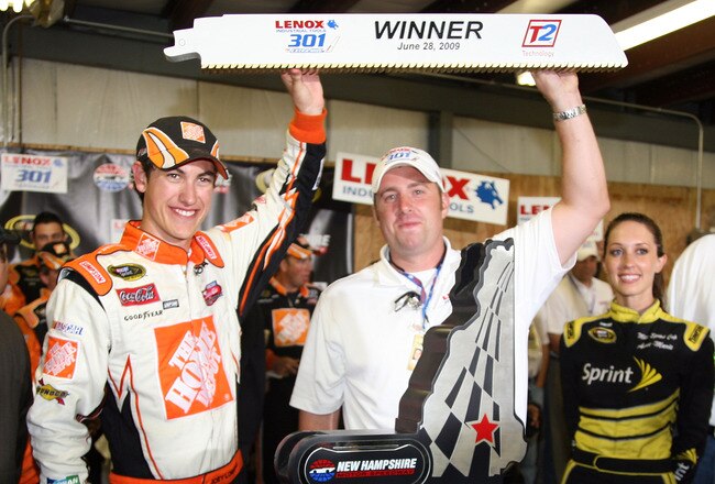 LOUDON, NH - JUNE 28:  Joey Logano, driver of the #20 Home Depot Toyota, celebrates winning the NASCAR Sprint Cup Series LENOX Industrial Tools 301 at New Hampshire Motor Speedway on June 28, 2009 in Loudon, New Hampshire. Logano won the rain shortened race with 27 laps remaining.  (Photo by Jerry Markland/Getty Images for NASCAR)