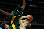 HOUSTON - MARCH 28: Kyle Singler #12 of the Duke Blue Devils tries to shoot as Josh Lomers #50 and Ekpe Udoh #13 of the Baylor Bears defend during the south regional final of the 2010 NCAA men's basketball tournament at Reliant Stadium on March 28, 2010 in Houston, Texas. Duke defeated Baylor 78-71. (Photo by Jonathan Daniel/Getty Images)