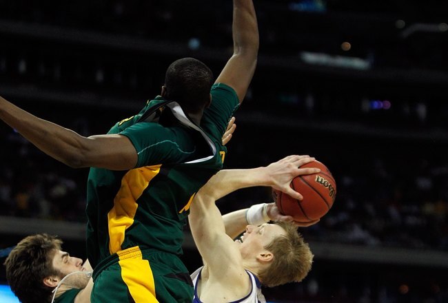 HOUSTON - MARCH 28: Kyle Singler #12 of the Duke Blue Devils tries to shoot as Josh Lomers #50 and Ekpe Udoh #13 of the Baylor Bears defend during the south regional final of the 2010 NCAA men's basketball tournament at Reliant Stadium on March 28, 2010 in Houston, Texas. Duke defeated Baylor 78-71. (Photo by Jonathan Daniel/Getty Images)