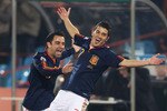 PRETORIA, SOUTH AFRICA - JUNE 25:  David Villa of Spain celebrates scoring the opening goal with team mate Xavi Hernandez during the 2010 FIFA World Cup South Africa Group H match between Chile and Spain at Loftus Versfeld Stadium on June 25, 2010 in Tshwane/Pretoria, South Africa.  (Photo by Phil Cole/Getty Images)