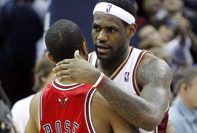CLEVELAND - APRIL 27: LeBron James #23 of the Cleveland Cavaliers talks with Derrick Rose #1 of the Chicago Bulls after defeating the Bulls 96-94 in Game Five of the Eastern Conference Quarterfinals during the 2010 NBA Playoffs at Quicken Loans Arena on April 27, 2010 in Cleveland, Ohio. Cleveland won the series 4-1. NOTE TO USER: User expressly acknowledges and agrees that, by downloading and or using this photograph, User is consenting to the terms and conditions of the Getty Images License Agreement.  (Photo by Gregory Shamus/Getty Images)