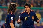 PRETORIA, SOUTH AFRICA - JUNE 25:  Joan Capdevila and Carles Puyol during the 2010 FIFA World Cup South Africa Group H match between Chile and Spain at Loftus Versfeld Stadium on June 25, 2010 in Tshwane/Pretoria, South Africa.  (Photo by Stuart Franklin/Getty Images)