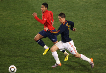PRETORIA, SOUTH AFRICA - JUNE 25: Fernando Torres of Spain and Gonzalo Jara of Chile chase the ball during the 2010 FIFA World Cup South Africa Group H match between Chile and Spain at Loftus Versfeld Stadium on June 25, 2010 in Tshwane/Pretoria, South Africa.  (Photo by Ian Walton/Getty Images)