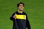 DURBAN, SOUTH AFRICA - JUNE 24:  Kaka gives the thumbs up to some local kids during the Brazil training session at the Princess Magogo Stadium on June 24, 2010 in Durban, South Africa. Brazil will play their last 2010 FIFA World Cup Group G match against Portugal on 25th June at the Moses Mabidha Stadium, Durban.  (Photo by Richard Heathcote/Getty Images)