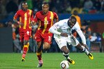 RUSTENBURG, SOUTH AFRICA - JUNE 26: Jozy Altidore of the United States stumbles under the challenge of Andre Ayew of Ghana during the 2010 FIFA World Cup South Africa Round of Sixteen match between USA and Ghana at Royal Bafokeng Stadium on June 26, 2010 in Rustenburg, South Africa.  (Photo by Kevork Djansezian/Getty Images)