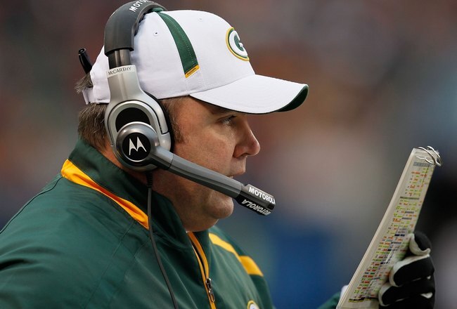 CHICAGO - DECEMBER 13: Head coach Mike McCarthy of the Green Bay Packers calls an offensive play against the Chicago Bears at Soldier Field on December 13, 2009 in Chicago, Illinois. The Packers defeated the Bears 21-14. (Photo by Jonathan Daniel/Getty Images)