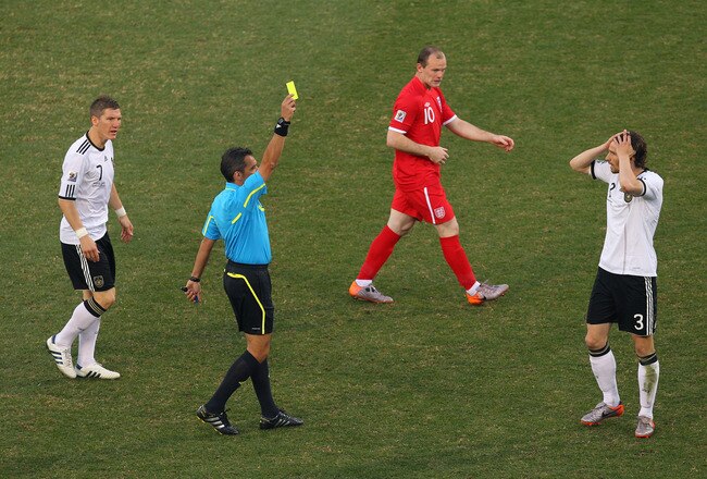 BLOEMFONTEIN, SOUTH AFRICA - JUNE 27:  Arne Friedrich of Germany receives a yellow card from referee Jorge Larrionda during the 2010 FIFA World Cup South Africa Round of Sixteen match between Germany and England at Free State Stadium on June 27, 2010 in Bloemfontein, South Africa.  (Photo by Cameron Spencer/Getty Images)