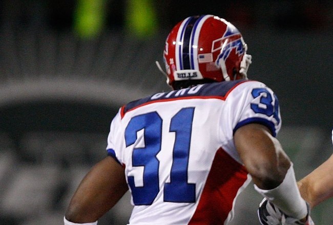 EAST RUTHERFORD, NJ - OCTOBER 18: Braylon Edwards #17 of the New York Jets runs past Jairus Byrd #31 and Aaron Schobel #94 of the Buffalo Bills during the game on October 18, 2009 at Giants Stadium in East Rutherford, New Jersey. The Bills defeated the Jets 16-13 in overtime. (Photo by Jared Wickerham/Getty Images)