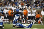 DETROIT, MI - NOVEMBER 22: Josh Cribbs #16 of the Cleveland Browns jumps over a defender while running with the football against the Detroit Lions at Ford Field on November 22, 2009 in Detroit, Michigan. The Lions came from behind to defeat the Browns 38-37. (Photo by Joe Robbins/Getty Images)