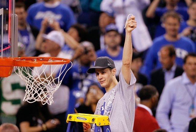 INDIANAPOLIS - APRIL 05:  Jon Scheyer of the Duke Blue Devils celebrates after he cut down a piece of the net following their 61-59 win against the Butler Bulldogs during the 2010 NCAA Division I Men's Basketball National Championship game at Lucas Oil Stadium on April 5, 2010 in Indianapolis, Indiana.  (Photo by Kevin C. Cox/Getty Images)