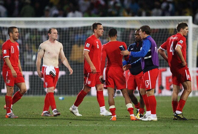 BLOEMFONTEIN, SOUTH AFRICA - JUNE 27:  Joe Cole, Wayne Rooney, John Terry and Steven Gerrard of England look dejected, after suffering defeat to Germany, following the 2010 FIFA World Cup South Africa Round of Sixteen match between Germany and England at Free State Stadium on June 27, 2010 in Bloemfontein, South Africa.  (Photo by Joern Pollex/Getty Images)