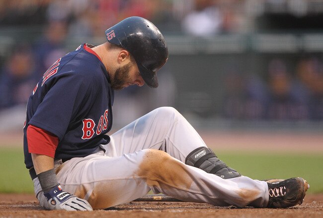 SAN FRANCISCO - JUNE 25:  Dustin Pedroia #15 of the Boston Red Sox looks on after being struck by a foul ball against the San Francisco Giants in the third inning during an MLB game at AT&T Park on June 25, 2010 in San Francisco, California. Pedroia left the game later in the inning.  (Photo by Jed Jacobsohn/Getty Images)