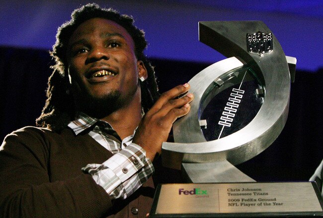 FORT LAUDERDALE, FL - FEBRUARY 03:  Chris Johnson #28 of the Tennessee Titans smiles with his award after being named the FedEx Ground NFL Player of the Year at a press conference held at the Fort Lauderdale Convention Center as part of media week for Super Bowl XLIV on February 3, 2010 in Fort Lauderdale, Florida.  (Photo by Doug Benc/Getty Images)