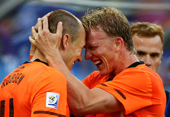 DURBAN, SOUTH AFRICA - JUNE 28:  Dirk Kuyt of the Netherlands celebrates with Arjen Robben as he scores the opening goal during the 2010 FIFA World Cup South Africa Round of Sixteen match between Netherlands and Slovakia at Durban Stadium on June 28, 2010 in Durban, South Africa.  (Photo by Doug Pensinger/Getty Images)