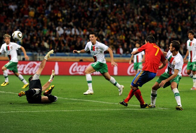 CAPE TOWN, SOUTH AFRICA - JUNE 29:  David Villa of Spain scores his side's first goal past Eduardo of Portugal during the 2010 FIFA World Cup South Africa Round of Sixteen match between Spain and Portugal at Green Point Stadium on June 29, 2010 in Cape Town, South Africa.  (Photo by Jasper Juinen/Getty Images)