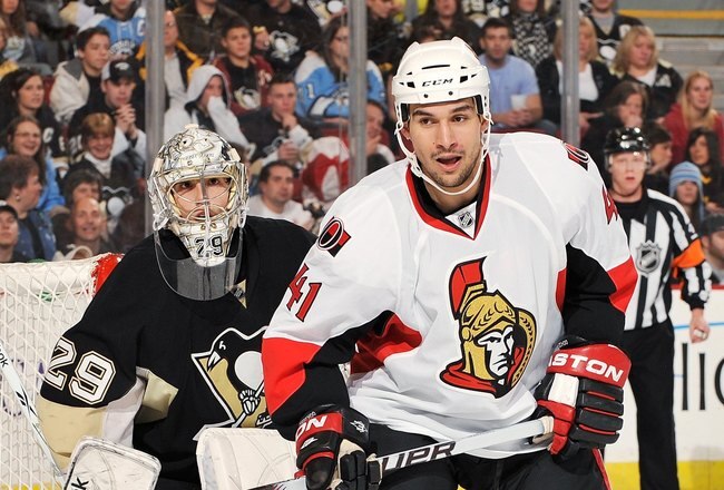 PITTSBURGH - DECEMBER 23:  Forward Jonathan Cheechoo #41 of the Ottawa Senators skates in front of goaltender Marc-Andre Fleury #29 of the Pittsburgh Penguins on December 23, 2009 at Mellon Arena in Pittsburgh, Pennsylvania.  (Photo by Jamie Sabau/Getty Images)