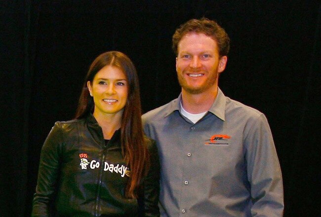 MOORESVILLE, NC - DECEMBER 17:  Danica Patrick (L), driver of the #7 GoDaddy.com Chevrolet poses with team owner Dale Earnhardt Jr. (R), at JR Motorsports on December 17, 2009 in Mooresville, North Carolina.  (Photo by Jason Smith/Getty Images)