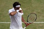 LONDON, ENGLAND - JUNE 30:  Roger Federer of Switzerland reacts during his Quarter Final match against Tomas Berdych of Czech Republic on Day Nine of the Wimbledon Lawn Tennis Championships at the All England Lawn Tennis and Croquet Club on June 30, 2010 in London, England.  (Photo by Clive Brunskill/Getty Images)