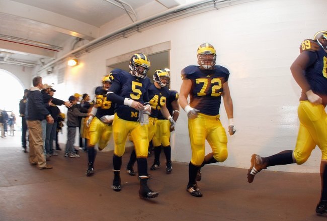 ANN ARBOR, MI - NOVEMBER 21: Quarteback Tate Forcier #5 of the Michigan Wolverines walks through the tunnel before the game against the Ohio State Buckeyes on November 21, 2009 at Michigan Stadium in Ann Arbor, Michigan. Ohio State won the game 21-10. (Photo by Gregory Shamus/Getty Images)
