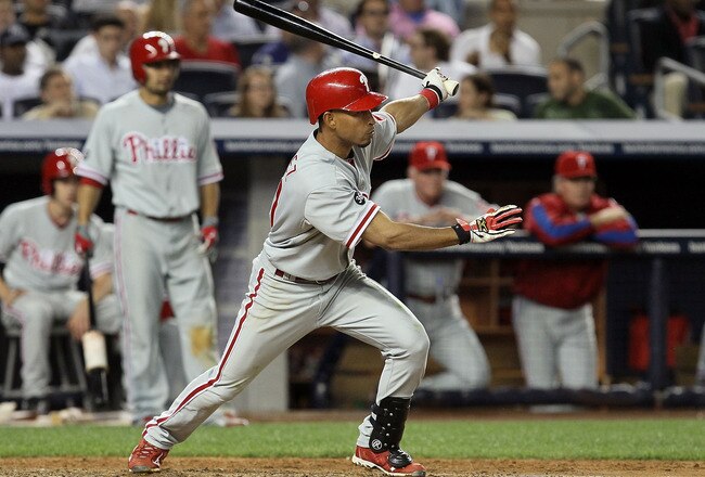 NEW YORK - JUNE 17:  Wilson Valdez #21 of the Philadelphia Phillies follows through on a RBI single in the ninth inning against the New York Yankees on June 17, 2010 at Yankee Stadium in the Bronx borough of New York City. The Phillies defeated the Yankees 7-1.  (Photo by Jim McIsaac/Getty Images)