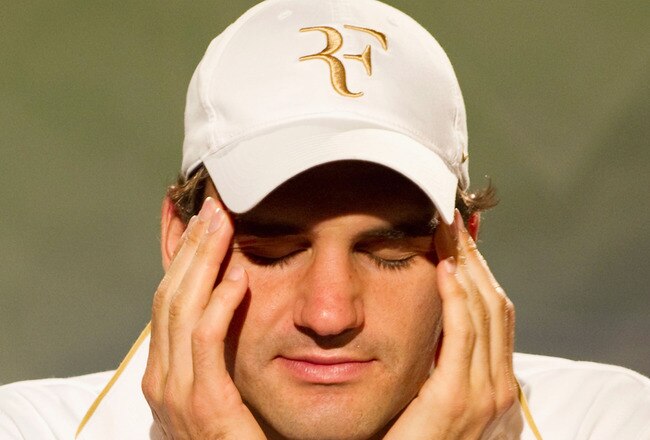 LONDON, ENGLAND - JUNE 30:  Roger Federer of Switzerland speaks during a press conference on Day Nine of the Wimbledon Lawn Tennis Championships at the All England Lawn Tennis and Croquet Club on June 30, 2010 in London, England. (Photo by Tom Lovelock-Pool/Getty Images)