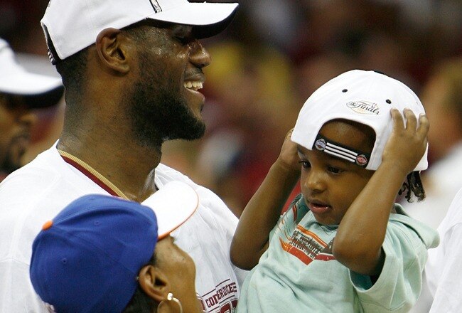 CLEVELAND - JUNE 02:  LeBron James #23 of the Cleveland Cavaliers celebrates with his son LeBron Jr. and his mother Gloria after their 98-82 win against the Detroit Pistons in Game Six of the Eastern Conference Finals during the 2007 NBA Playoffs on June 2, 2007 at the Quicken Loans Arena in Cleveland, Ohio. NOTE TO USER: User expressly acknowledges and agrees that, by downloading and or using this photograph, User is consenting to the terms and conditions of the Getty Images License Agreement.  (Photo by Gregory Shamus/Getty Images)