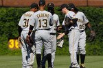 CHICAGO - JUNE 30: (L-R) Jose Tabata #31, Ronny Cedeno #13, Andrew McCutchen #22, Andy LaRoche #15 and Lastings Milledge #85 of the Pittsburgh Pirates shake hands after a win over the Chicago Cubs at Wrigley Field on June 30, 2010 in Chicago, Illinois. The Pirates defeated the Cubs 2-0. (Photo by Jonathan Daniel/Getty Images)