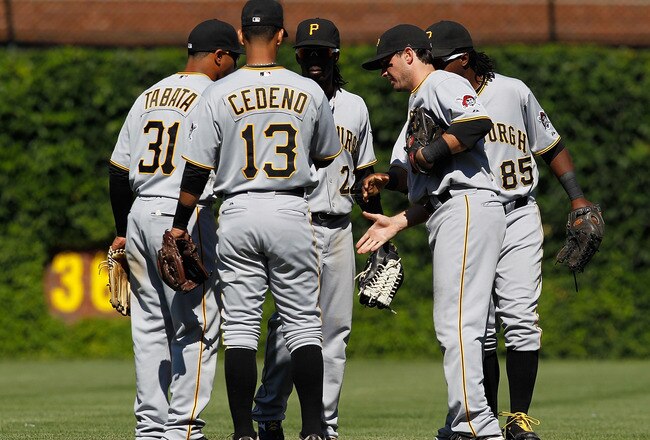 CHICAGO - JUNE 30: (L-R) Jose Tabata #31, Ronny Cedeno #13, Andrew McCutchen #22, Andy LaRoche #15 and Lastings Milledge #85 of the Pittsburgh Pirates shake hands after a win over the Chicago Cubs at Wrigley Field on June 30, 2010 in Chicago, Illinois. The Pirates defeated the Cubs 2-0. (Photo by Jonathan Daniel/Getty Images)