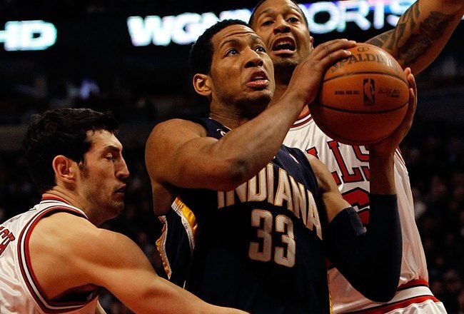 CHICAGO - FEBRUARY 24: Danny Granger #33 of the Indiana Pacers drives to the basket between Kirk Hinrich #12 and James Johnson #16 of the Chicago Bulls at the United Center on February 24, 2010 in Chicago, Illinois. The Bulls defeated the Pacers 120-110. NOTE TO USER: User expressly acknowledges and agrees that, by downloading and/or using this Photograph, User is consenting to the terms and conditions of the Getty Images License Agreement. (Photo by Jonathan Daniel/Getty Images)