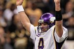 NEW ORLEANS - JANUARY 24:  Brett Favre #4 of the Minnesota Vikings reacts after the Vikings scored a touchdown against the New Orleans Saints during the NFC Championship Game at the Louisiana Superdome on January 24, 2010 in New Orleans, Louisiana. The Saints won 31-28 in overtime.  (Photo by Jed Jacobsohn/Getty Images)