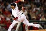 BOSTON - MAY 06:  Manny Delcarmen #17 of the Boston Red Sox delivers a pitch in the sixth inning against the Los Angeles Angels of Anaheim on May 6, 2010 at Fenway Park in Boston, Massachusetts.  (Photo by Elsa/Getty Images)