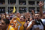 LOS ANGELES, CA - JUNE 21:  Fans cheer for the Los Angeles Lakers during their victory parade for the the NBA basketball champion team on June 21, 2010 in Los Angeles, California. The Lakers beat the Boston Celtics 87-79 in 7 games for the franchise's 16 NBA title.  (Photo by David McNew/Getty Images)